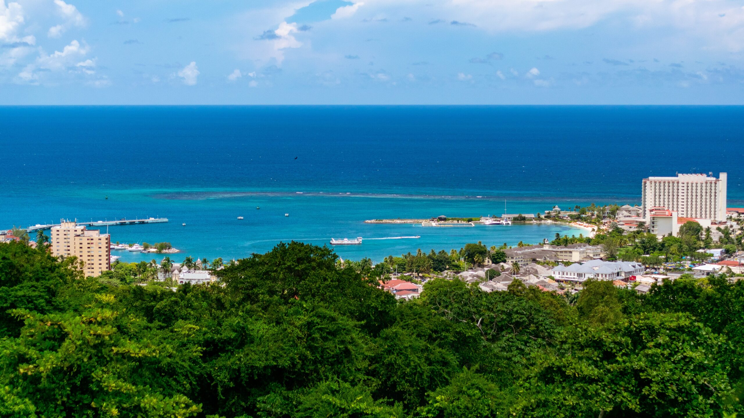 Aerial view to the Ocho Rios beach in Jamaica with clear blue waters and clear sky