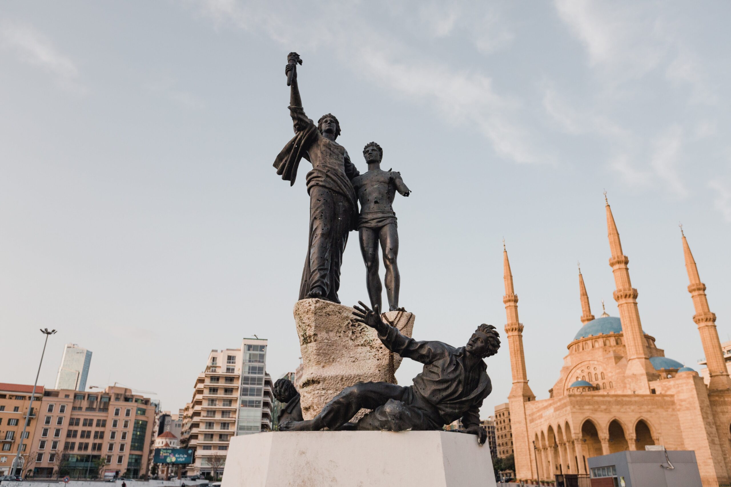 The Martyrs' Monument in Beirut. In the background, the Mohammad al-Amin mosque